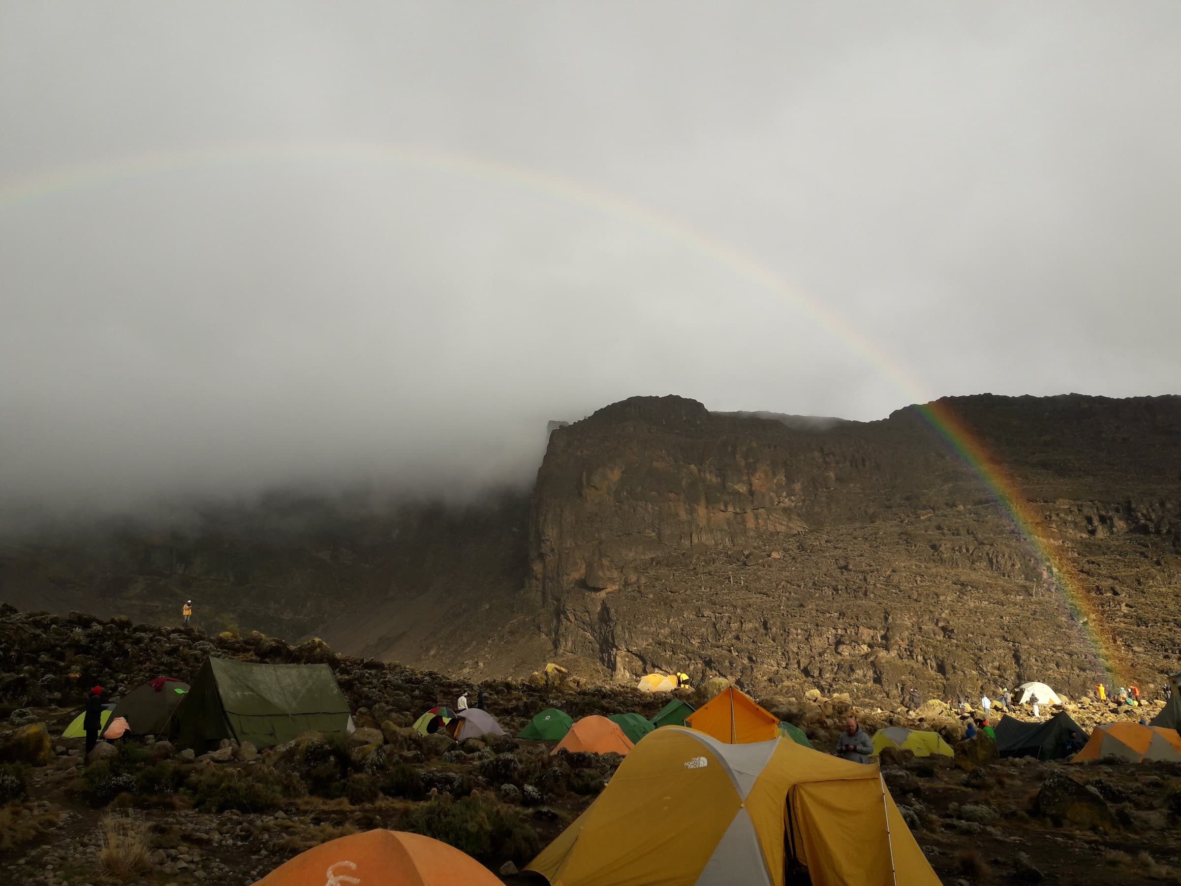 A rainbow over Barranco camp beneath the Barranco Wall