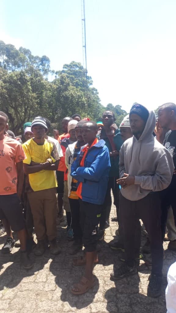 Porters gathered outdoors for a Kiliporters education session